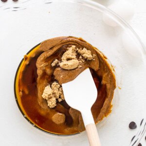 a pancake with a spoon in it on a plate.