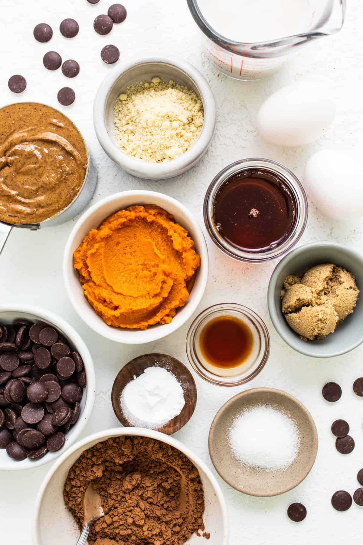 a table topped with bowls filled with different types of food.