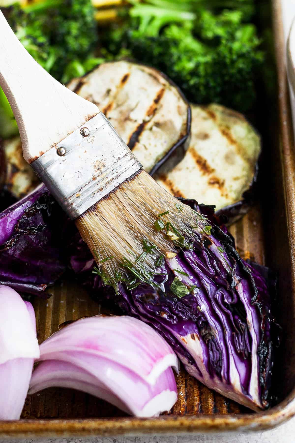 a close up of a brush with food in it.