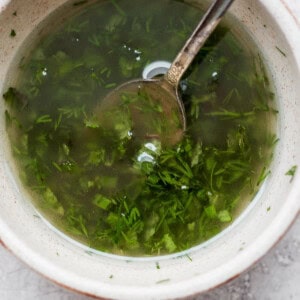 a bowl of soup with a spoon in it.