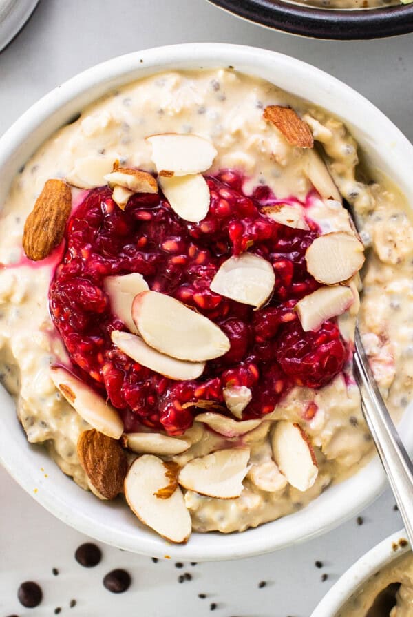 a bowl of oatmeal topped with fruit and nuts.