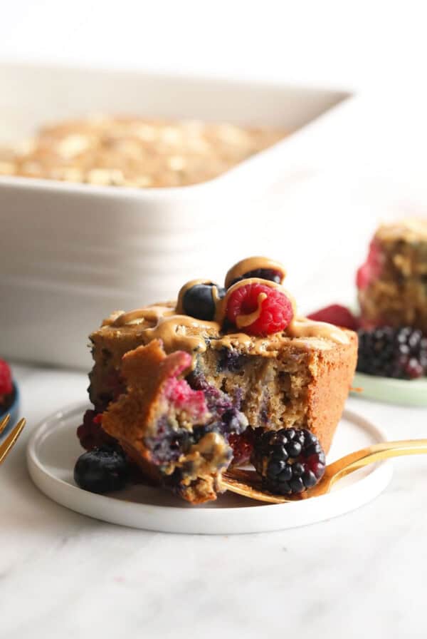 A close up of a plate of Triple berry breakfast bread on a table.