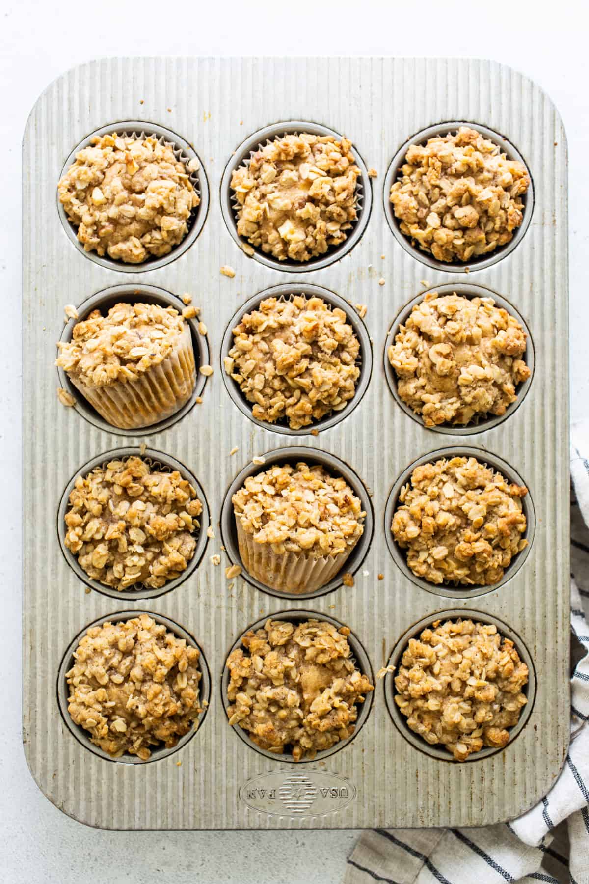 oatmeal muffins in a muffin tin.