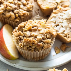 apple granola muffins on a white plate.