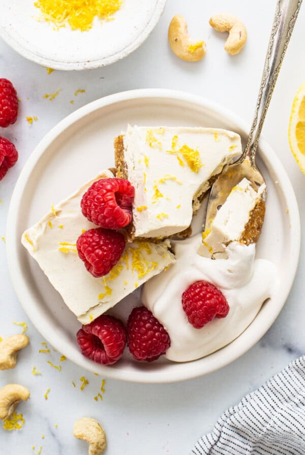 lemon cashew cheesecake with raspberries and cashews.