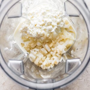 A food processor filled with ingredients.