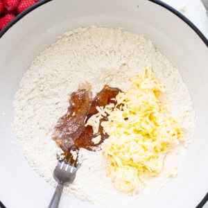 A bowl filled with ingredients for a cake.