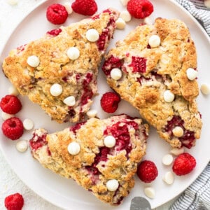 Raspberry and white chocolate scones on a plate.