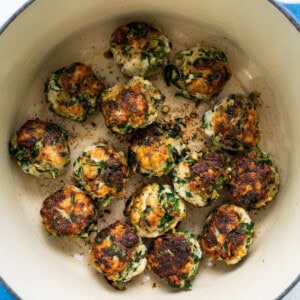 Chicken and spinach croquettes in a blue pot.