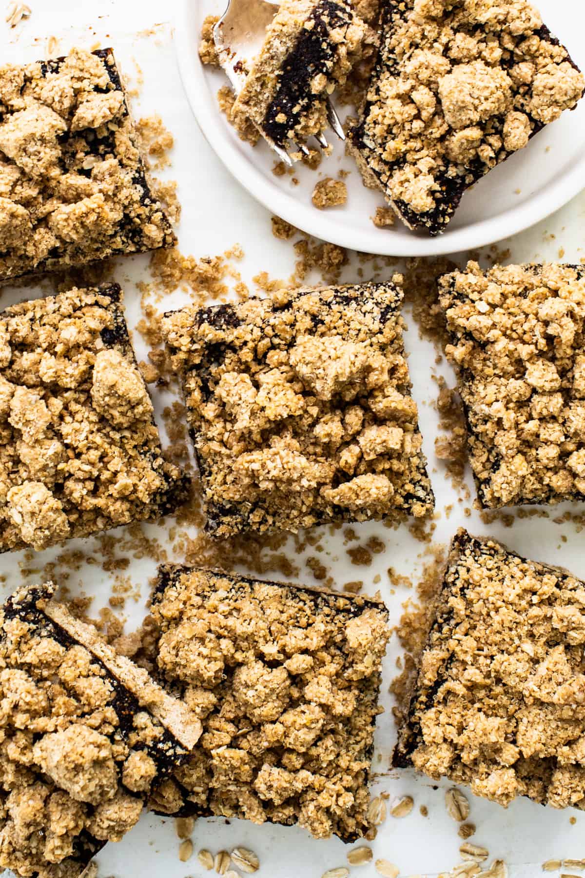 A plate of chocolate graham cracker bars on a white plate.