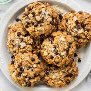 Chocolate chip oatmeal cookies on a plate.