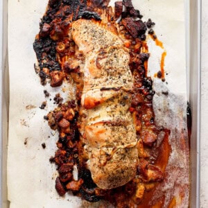 A piece of salmon on a baking sheet.