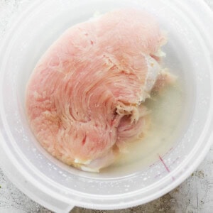 A bowl of chicken in a bowl of water.