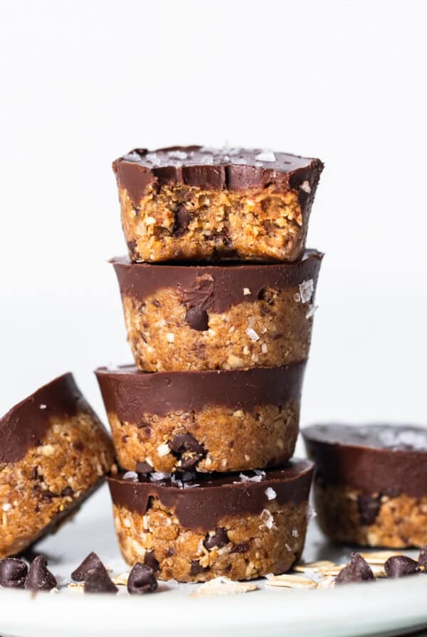 A stack of chocolate peanut butter cups on a plate.