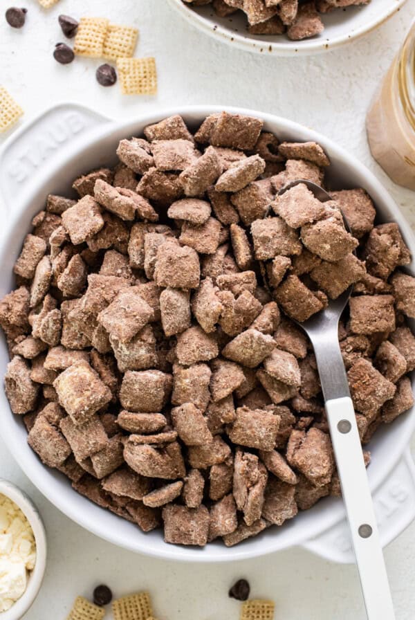 Chocolate peanut butter cheetos in a bowl with a spoon.