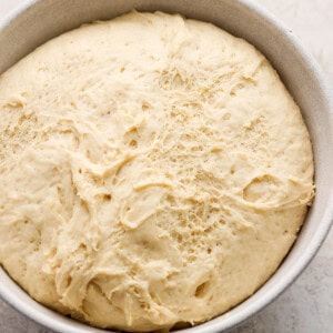 Dough in a bowl on a table.