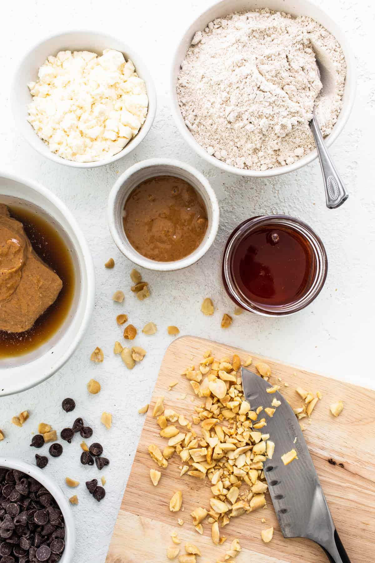 Ingredients for peanut butter cookie dough on a cutting board.