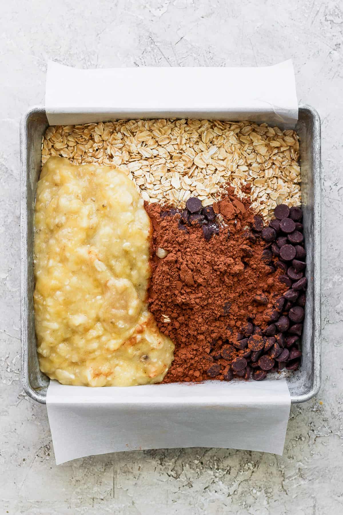 A baking pan filled with ingredients for banana bread.