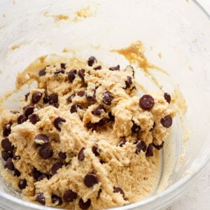 Chocolate chip cookie dough in a bowl.