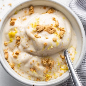 A bowl of food with a spoon.