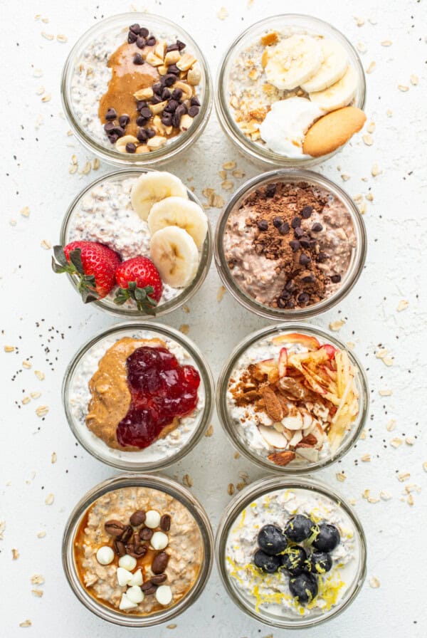 Five bowls of oatmeal with different toppings.