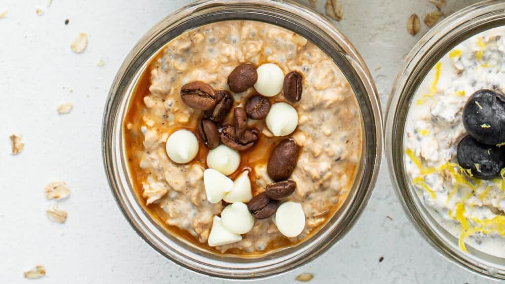 Three jars of oatmeal on a white background.