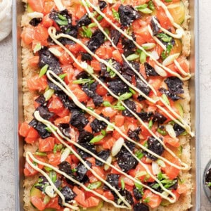 A tray with a pizza with toppings on it.