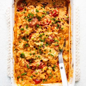 A casserole dish with a fork in it.