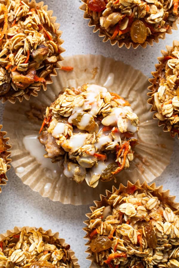 A group of muffins topped with granola.