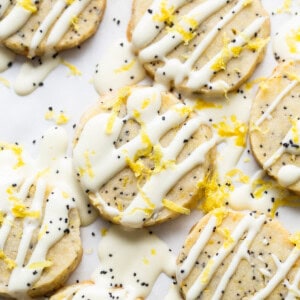 Lemon poppy seed cookies with icing and sprinkles.