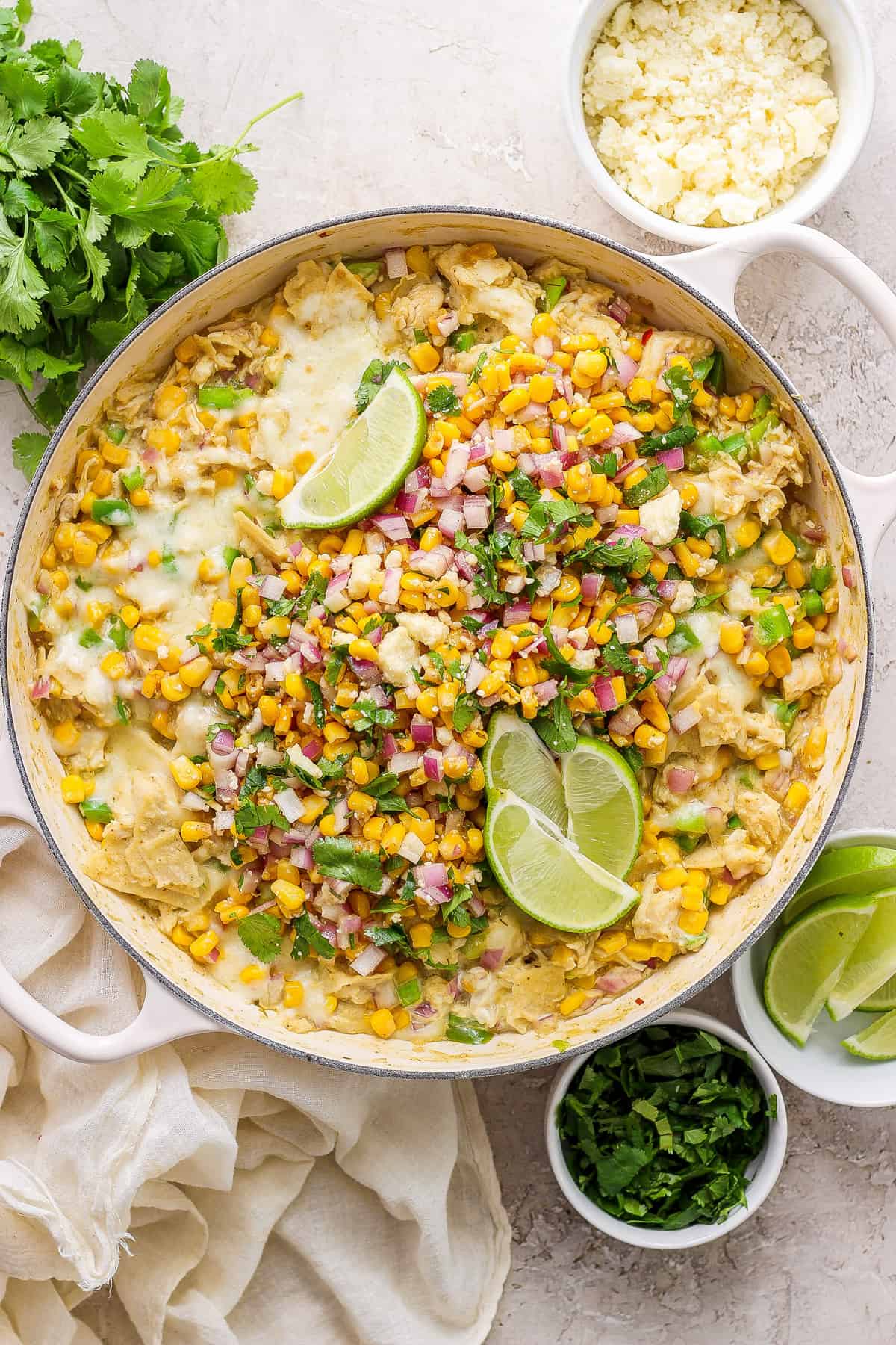 Mexican corn enchiladas in a skillet.