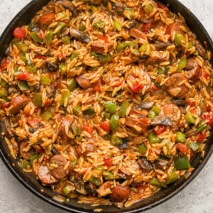 A skillet filled with rice and vegetables.