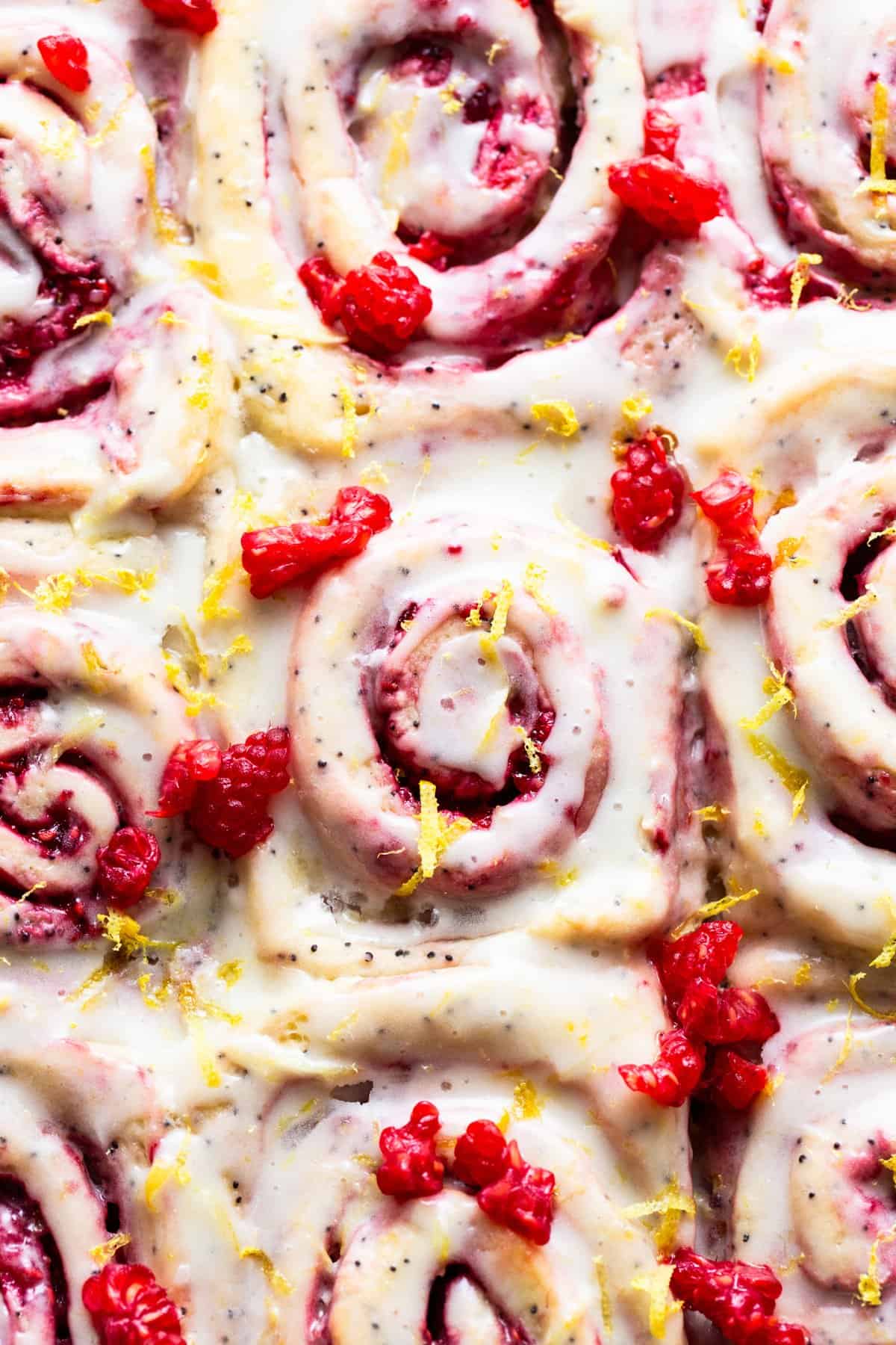 Raspberry cinnamon rolls with lemon icing.