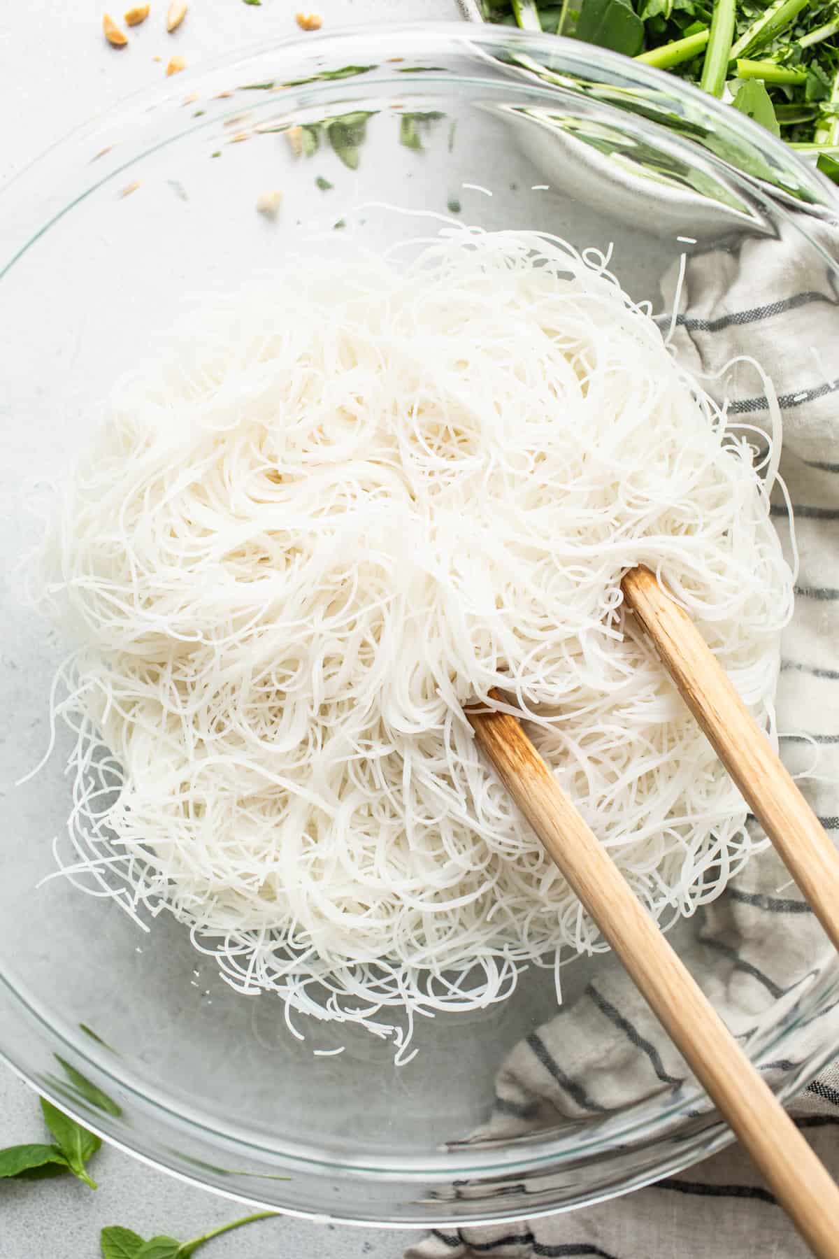 Noodles in a bowl with chopsticks.