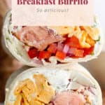 Image of a smoked salmon breakfast burrito cut in half, displaying layers of egg, salmon, and vegetables, with the text "so delicious!" at the bottom.